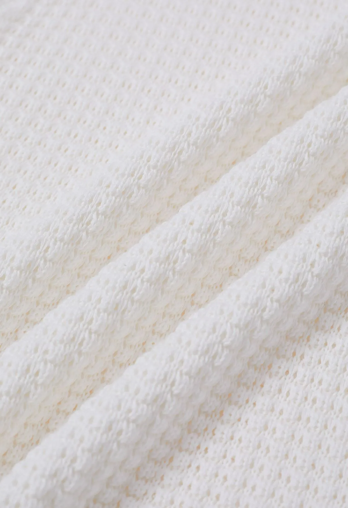 Haut sans manches en tricot ajouré de couleur unie en blanc